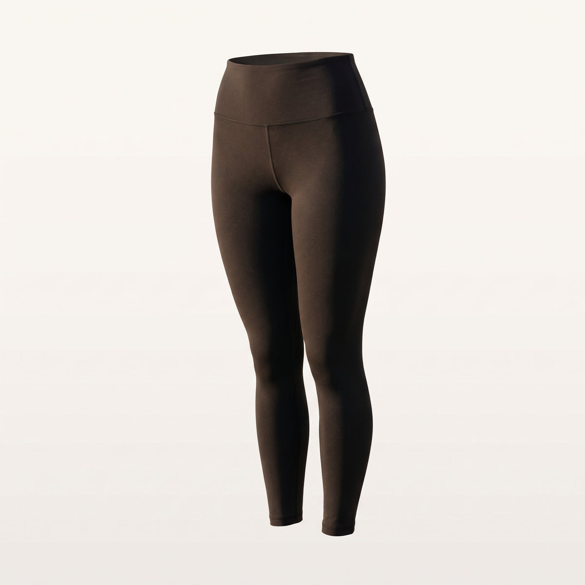 Legging noir à taille haute présenté sur fond uni