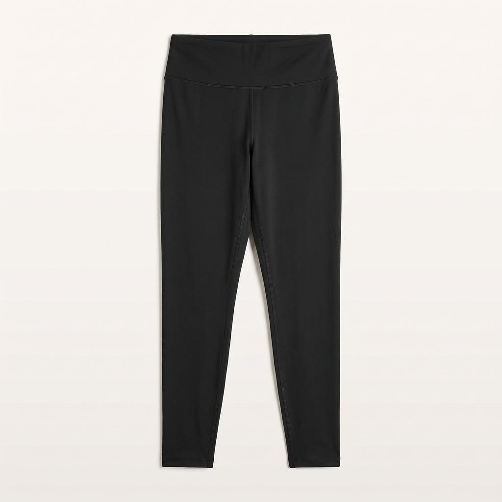Legging de sport noir présenté à plat sur fond uni