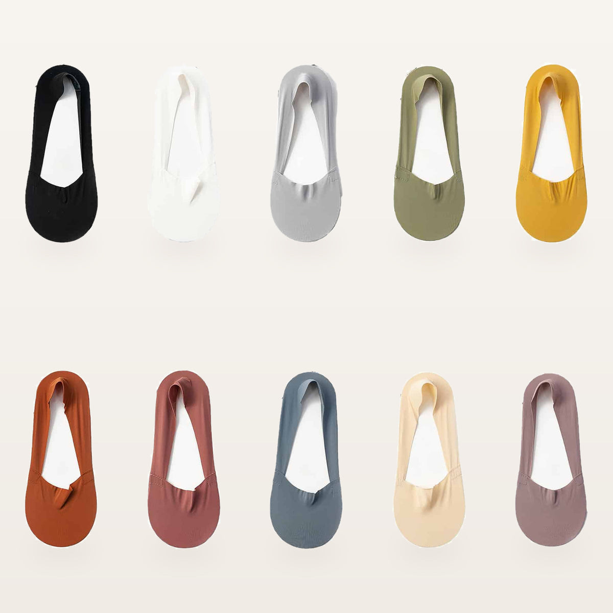 Les dix coloris unis des socquettes invisibles, une socquette par teinte Image