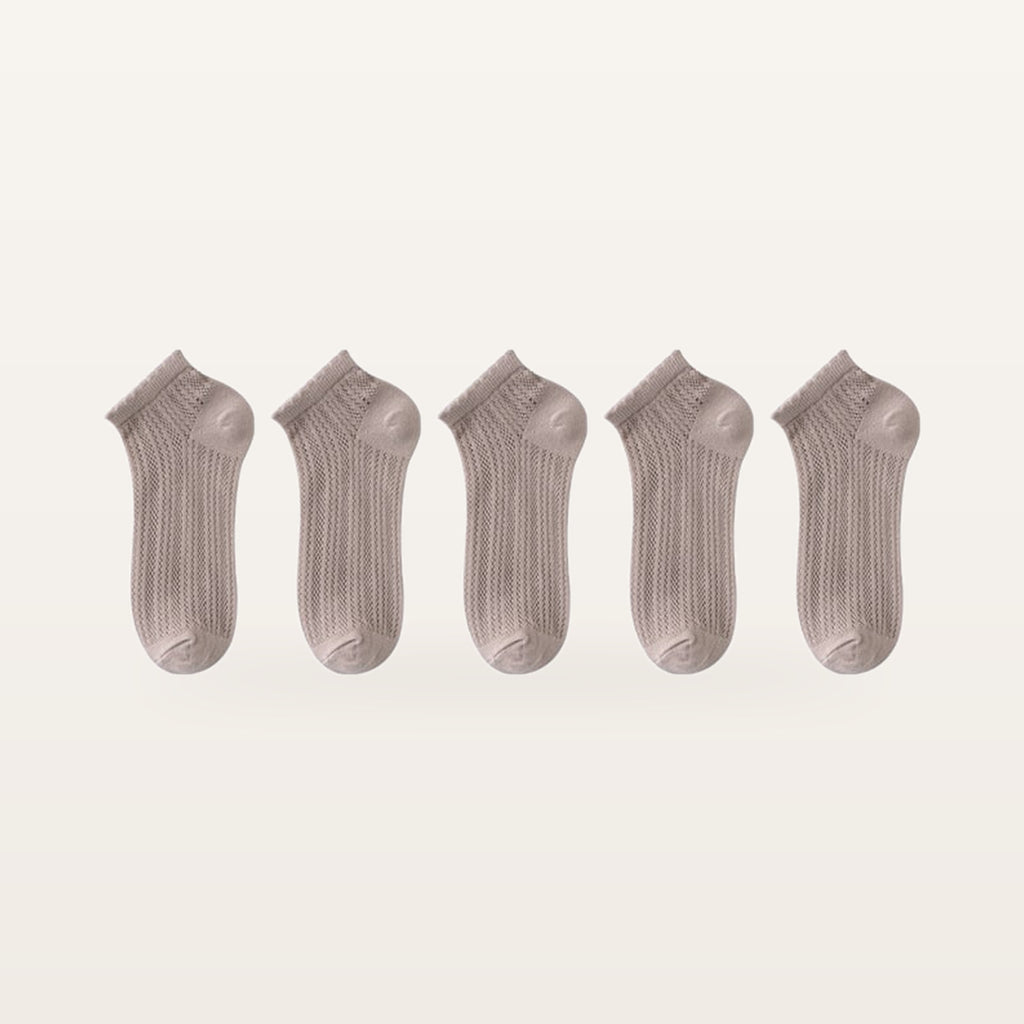 Lot de cinq paires de socquettes beige rosé en maille ajourée
