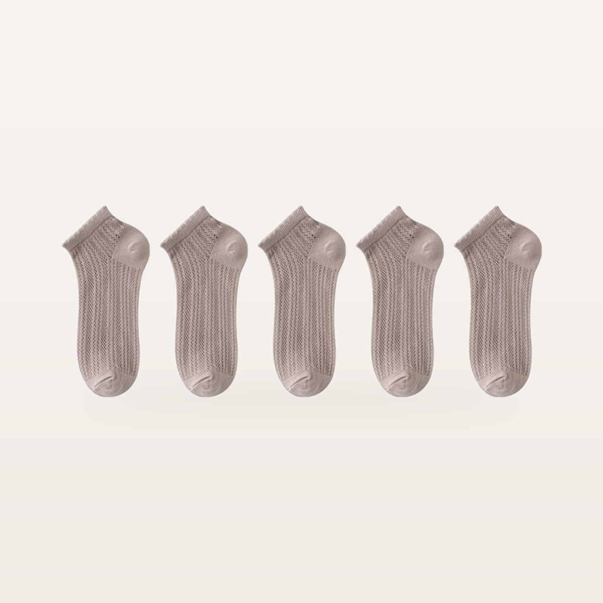 Lot de cinq paires de socquettes beige rosé en maille ajourée