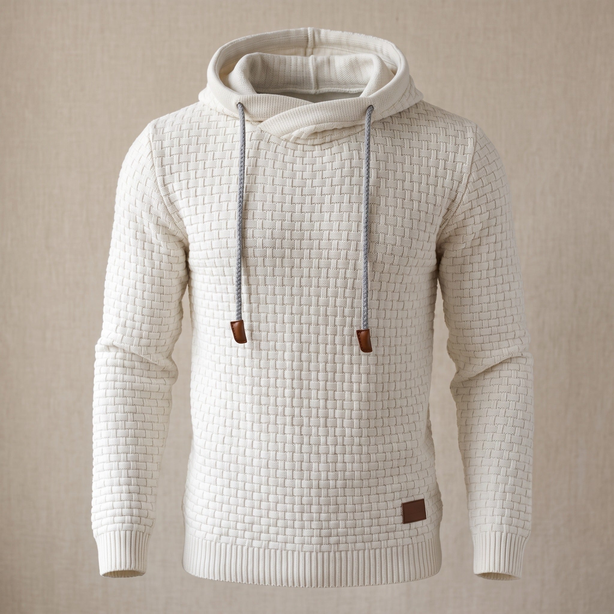Sweat à capuche gaufré blanc cassé présenté en mannequin invisible, vu de face, capuche rabattue dans le dos, poignets et bas en côtes. Image