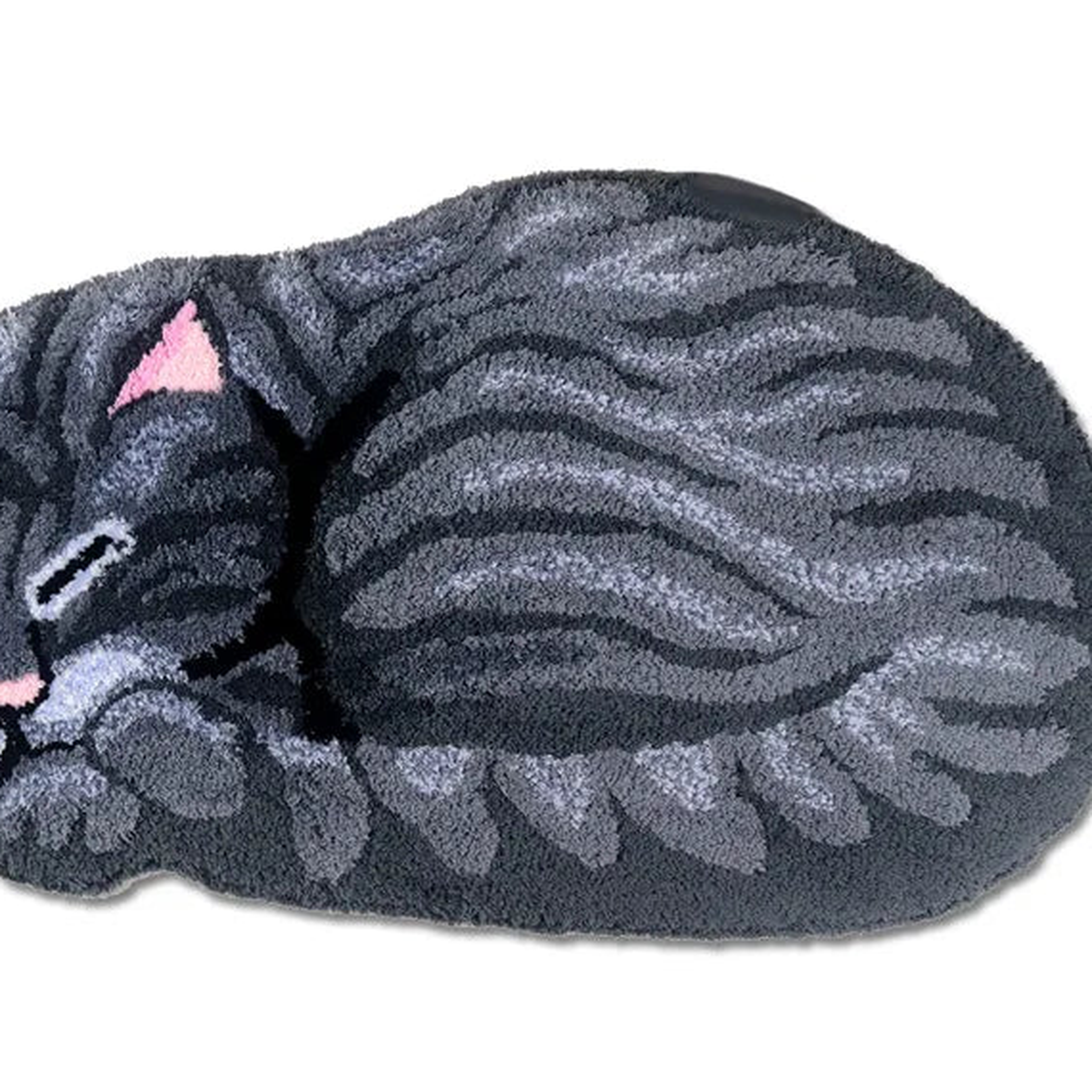 Détail des fibres et du motif du tapis chat gris Image