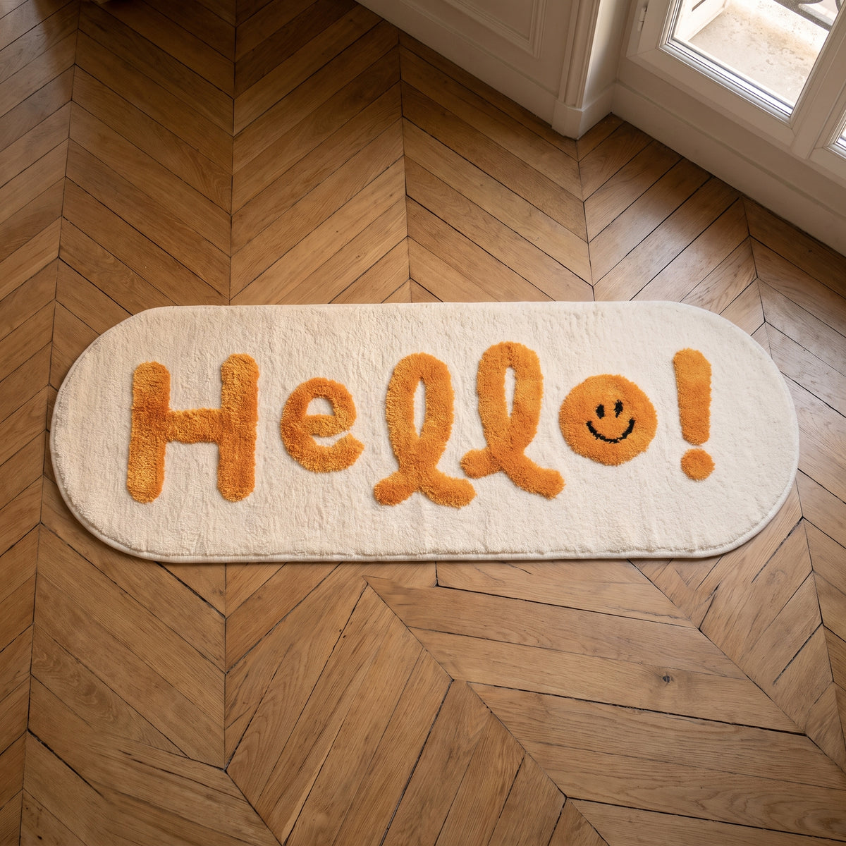 Tapis Hello vu du dessus, entier, sur un parquet en point de Hongrie Image