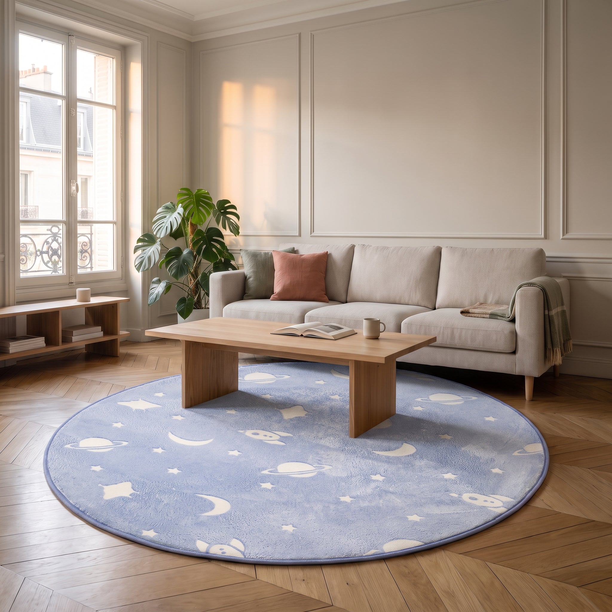 Tapis rond bleu à motif spatial au centre d'un salon Image