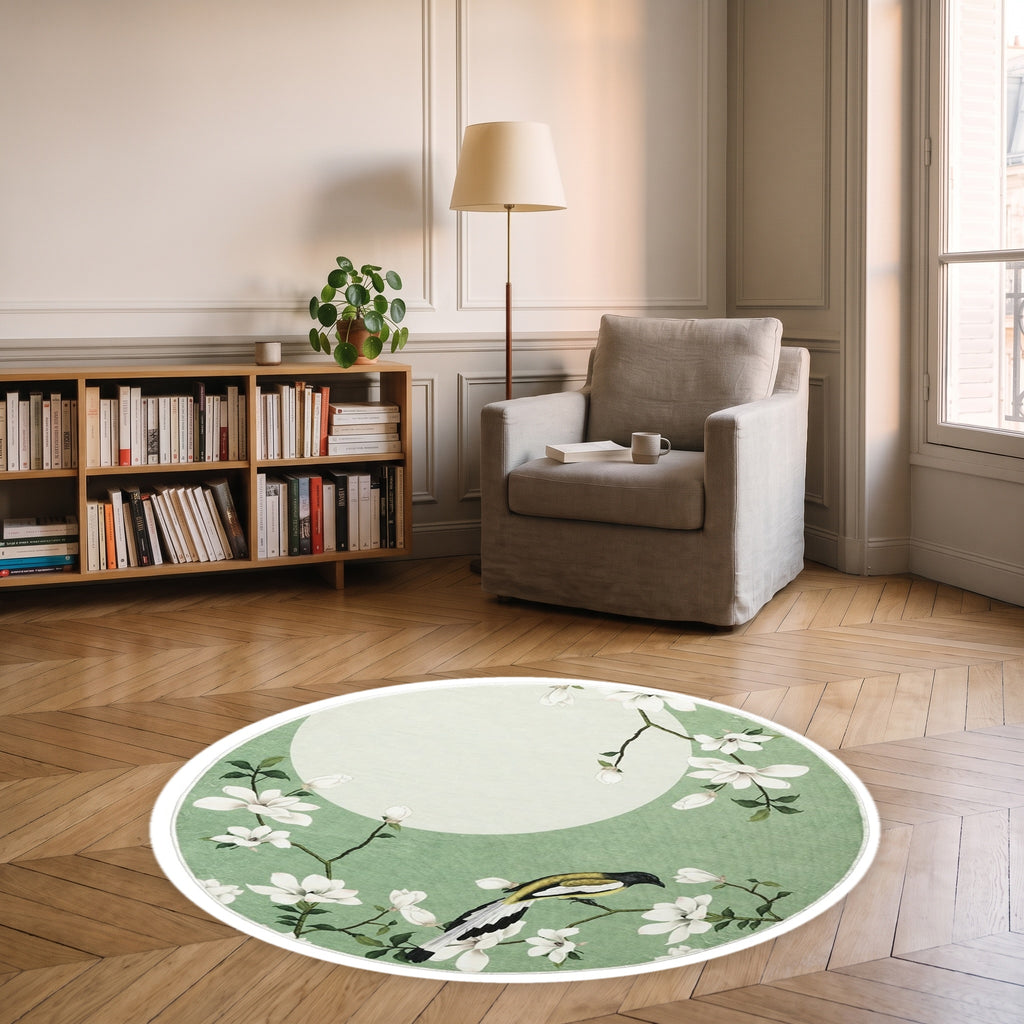Tapis rond vert avec magnolias et oiseau dans un coin lecture