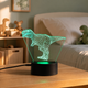 Lampe veilleuse dinosaure 3D à LED, modèle T-REX 1, allumée dans une chambre d'enfant