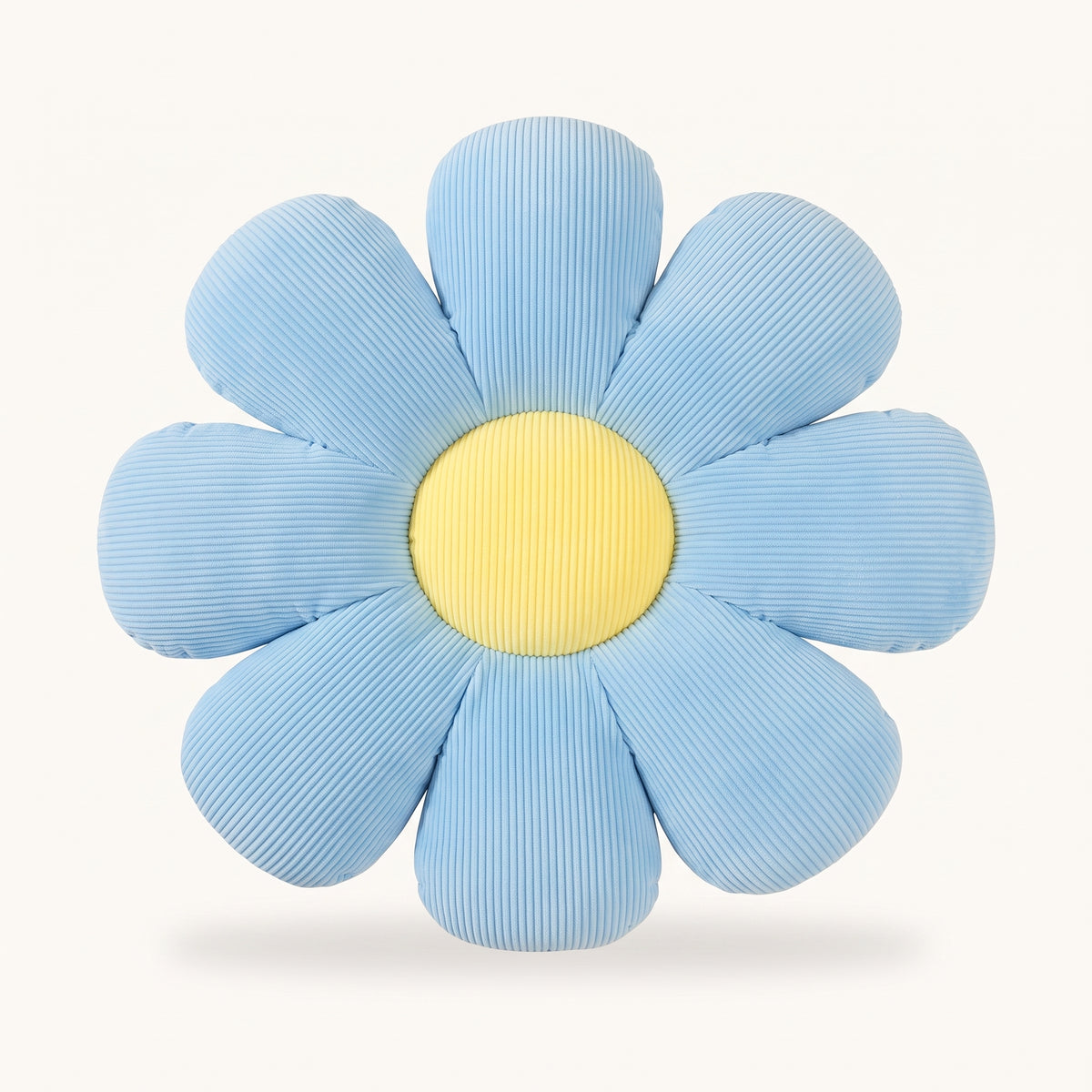 Coussin fleur bleu a huit petales sur fond uni