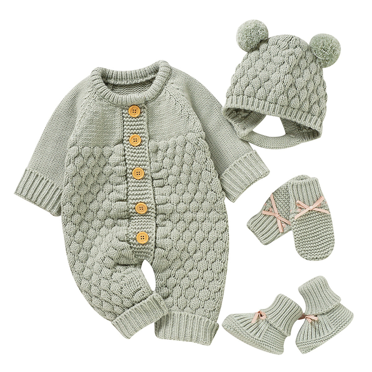 Ensemble quatre pièces en tricot vert d'eau pâle pour bébé sur fond clair